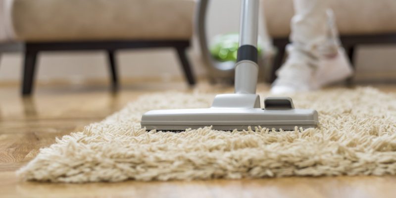 A closeup of a vacuum cleaner at a living room