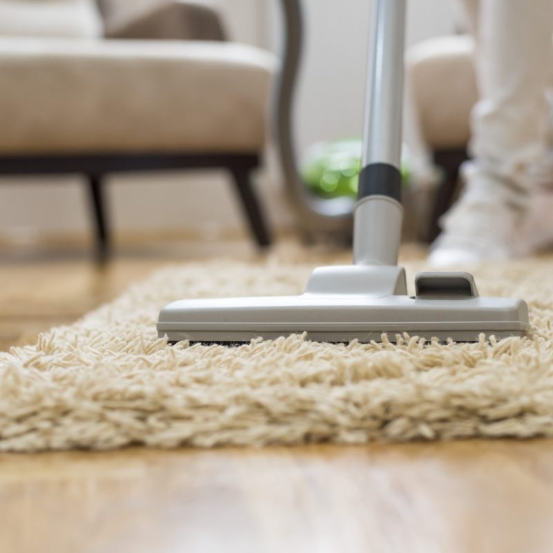 A closeup of a vacuum cleaner at a living room